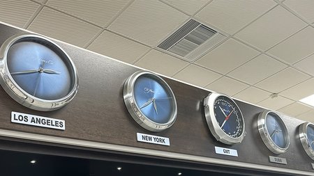 Skylink Services showcasing H. Moser & Cie. wall clocks